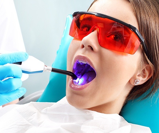 Woman receiving dental sealants