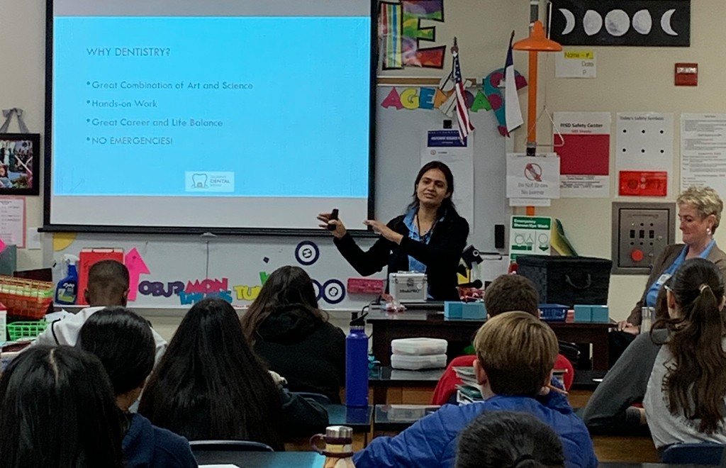 Dentist presenting to kids in classroom