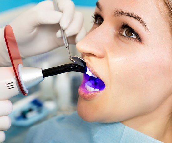 Patient receiving dental bonding treatment