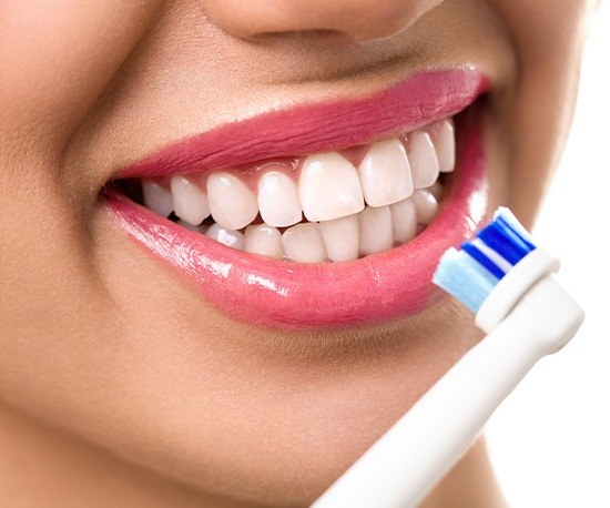 Woman brushing her teeth