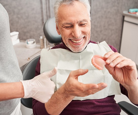 Denture patient in Murphy getting their new prosthetic