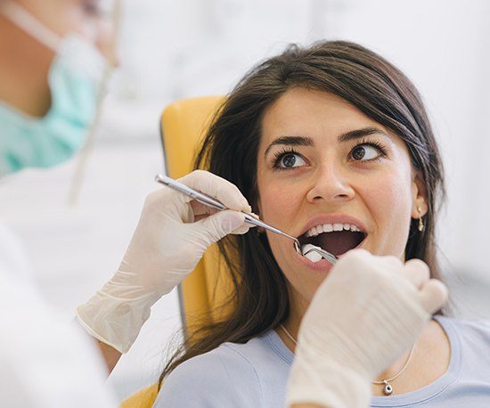 Woman receiving dental treatment