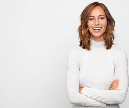 Smiling, happy woman wearing white sweater