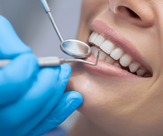 a patient getting their dental implants checked