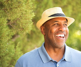 smiling man standing outside