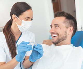Invisalign dentist in Murphy talking to a patient about Invisalign 