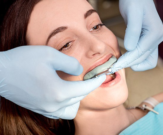 Patient receiving fluoride treatment