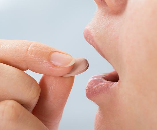 Patient taking oral sedative pill