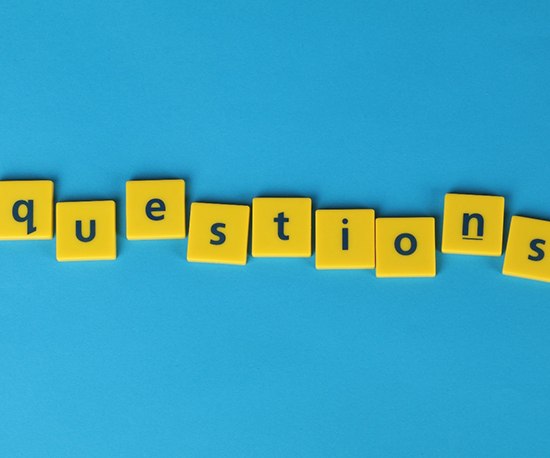Yellow letter tiles spelling questions