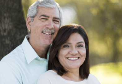 Older man and woman smiling outdoors