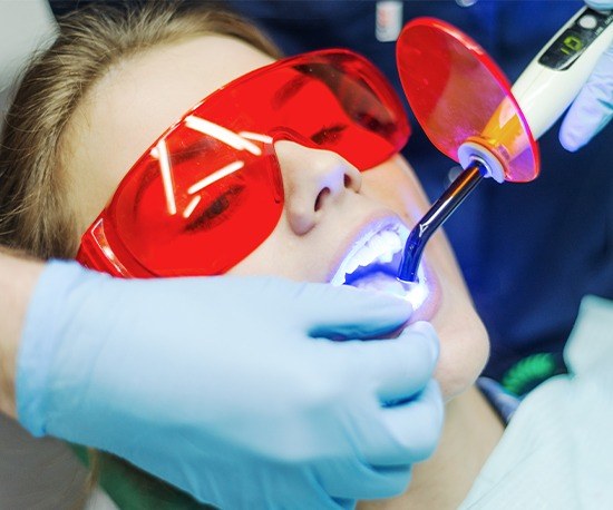 Woman recieing tooth-colored filling