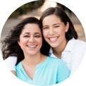 Two women smiling together outdoors