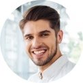 Smiling man in white collared shirt