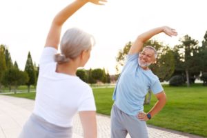 man smiles while exercising 