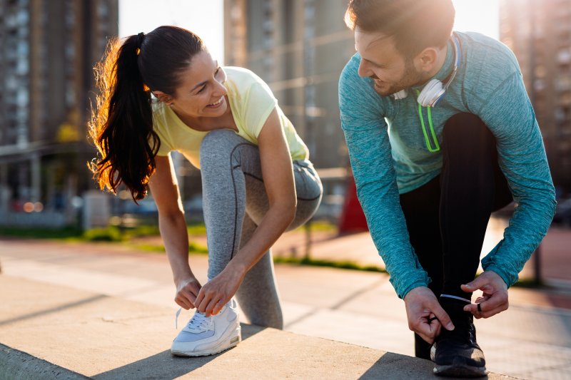 a young couple preparing to exercise together